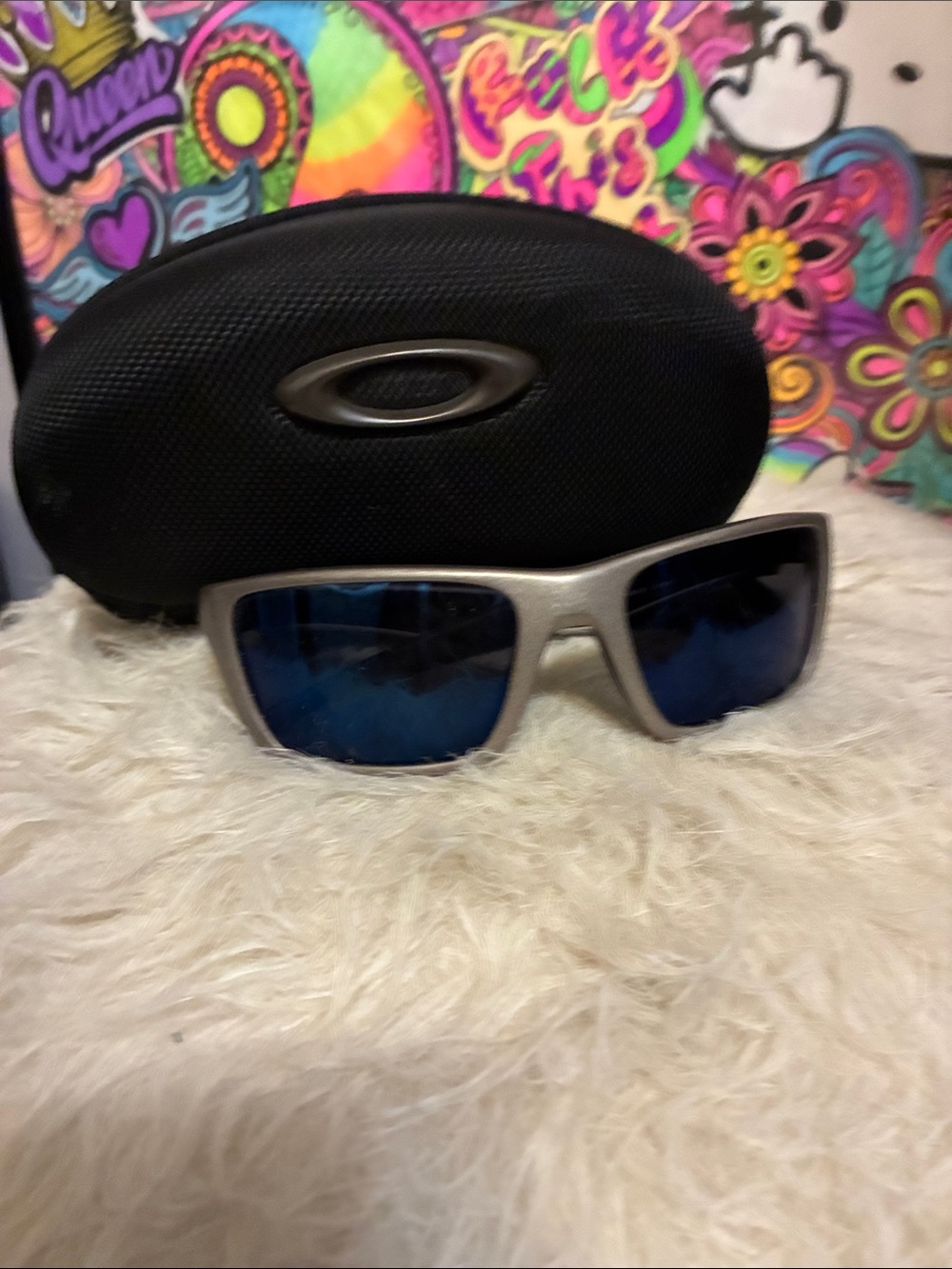 Oakley Metallic Silver Frame Sunglasses with Dark Blue Lenses